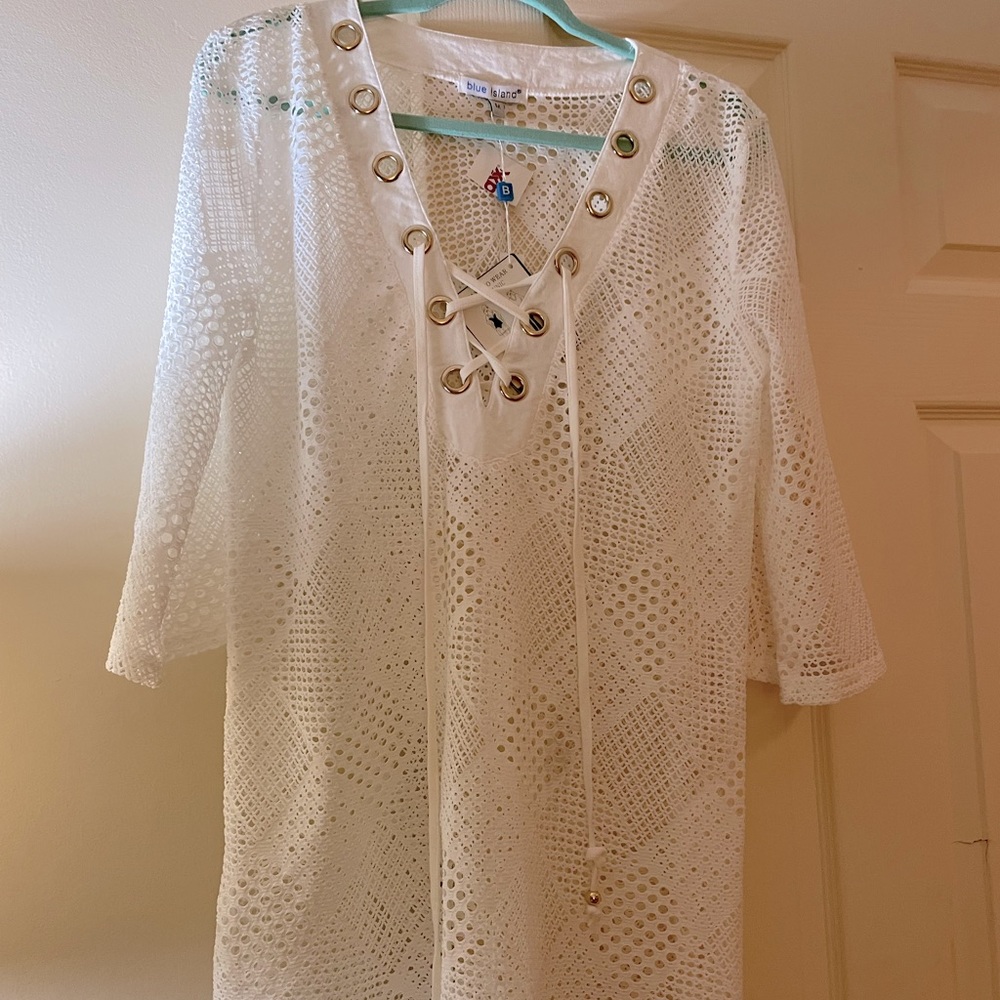 Never worn cover up size medium.